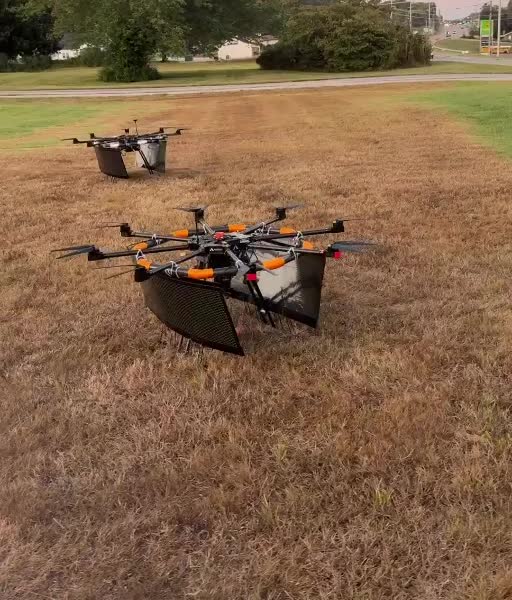 Two Aerial GraphX advertising drones prepared together for a multi-drone event campaign